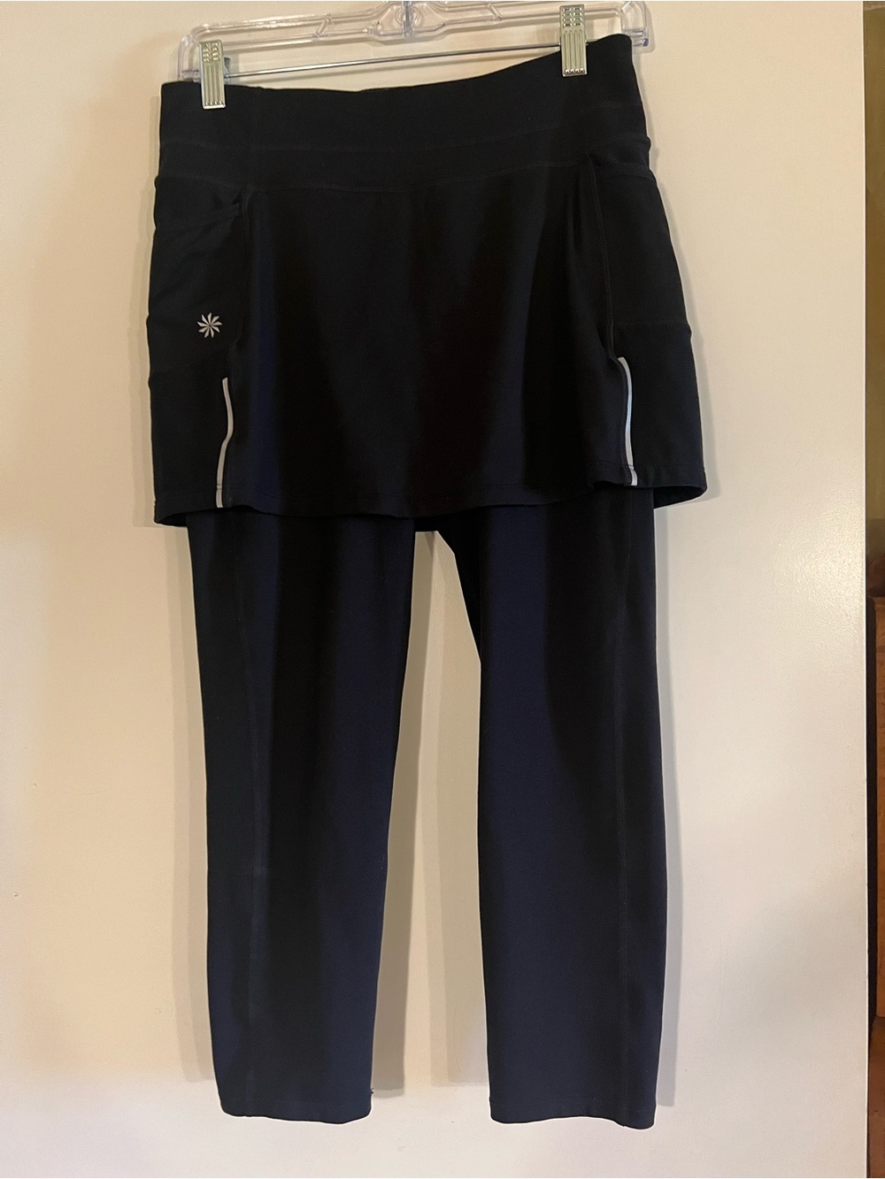 Small Black Athleta Skirted Leggings with Reflective Trim.